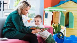 woman reading with toddler